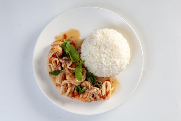 Fried Rice with Seafood and Basil isolated on white background