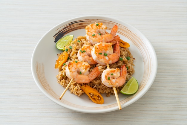 fried rice with shrimps or prawns skewers