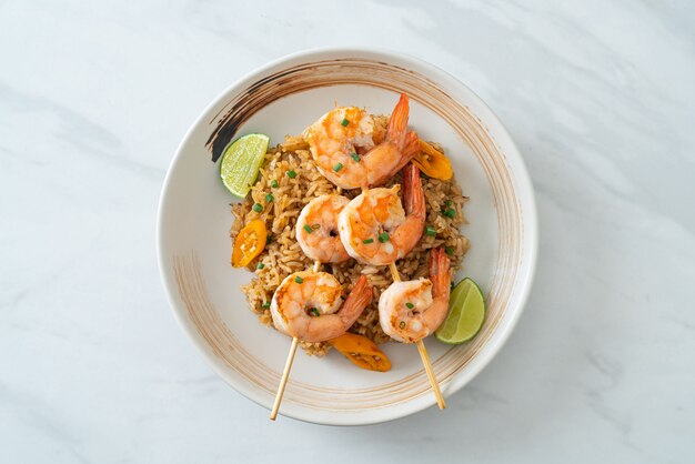 fried rice with shrimps or prawns skewers