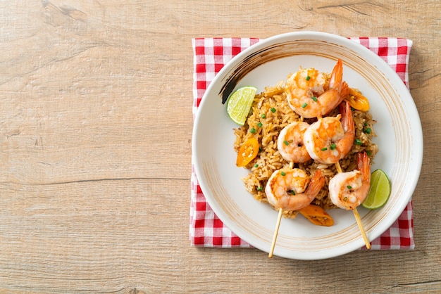 fried rice with shrimps or prawns skewers