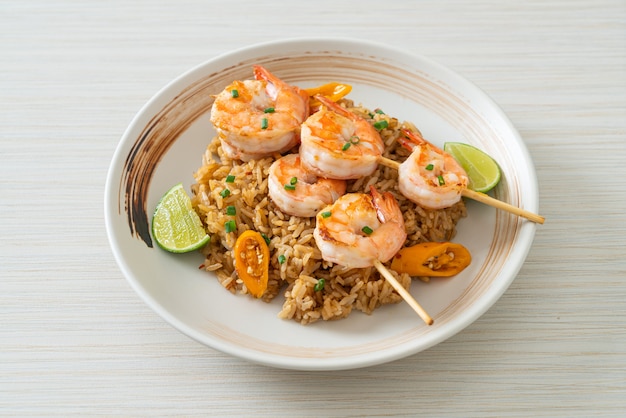 fried rice with shrimps or prawns skewers