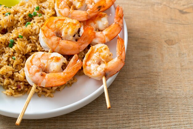 fried rice with shrimps or prawns skewers