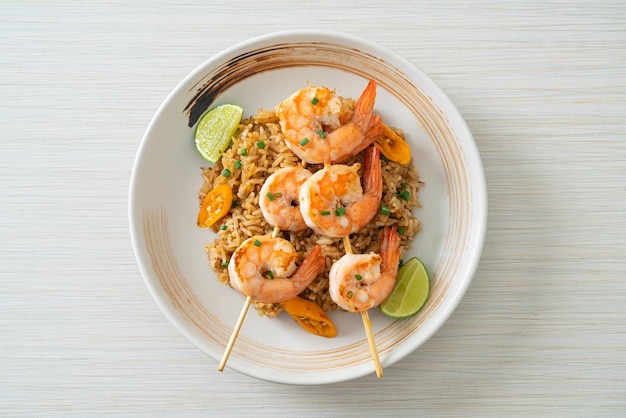 fried rice with shrimps or prawns skewers