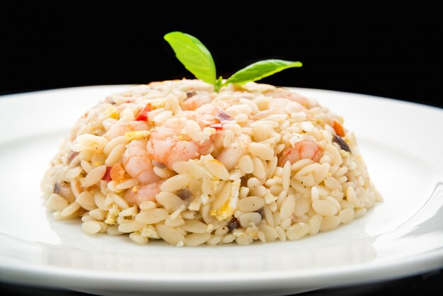 Fried rice with shrimps on wood