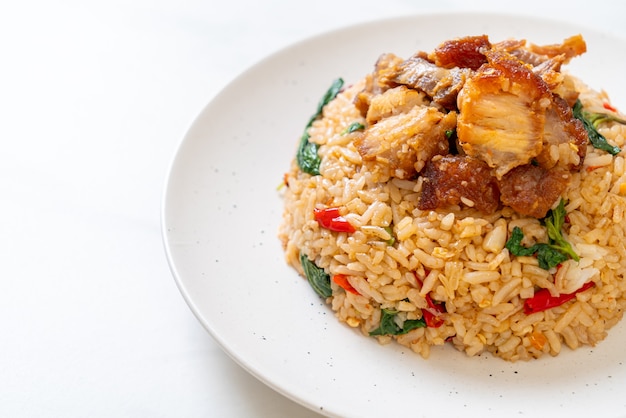 Fried rice with thai basil and crispy belly pork - thai food\
style