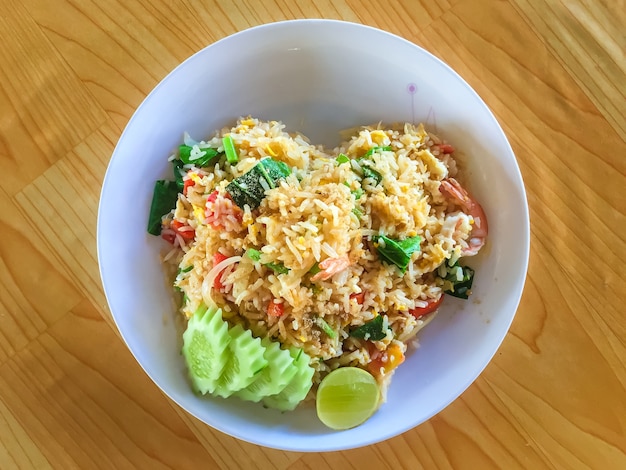 Fried rice on the wooden table.