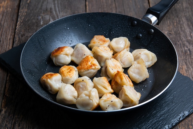 Fried russian dumplings in a pan