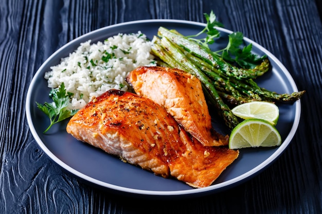 Fried salmon fish fillet with rice and asparagus