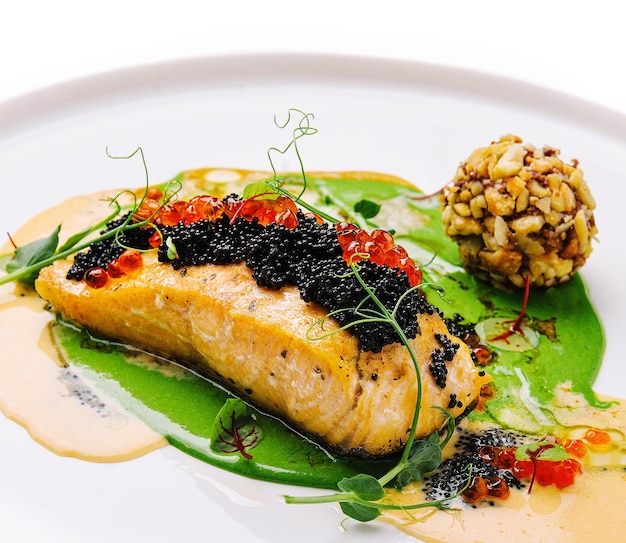 Fried salmon with red and black caviar