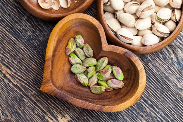 Fried salted pistachio nuts , close up