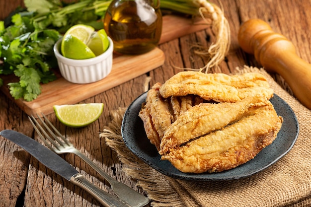 Fried sardines in the plate on the table.