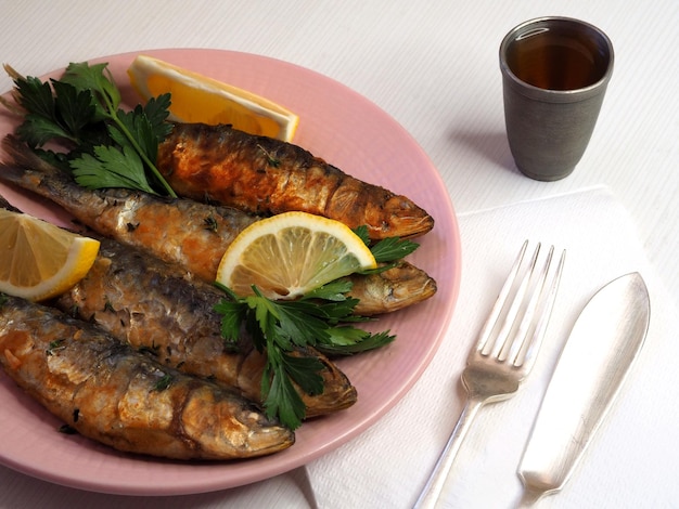 Fried sardines with lemon and herbs