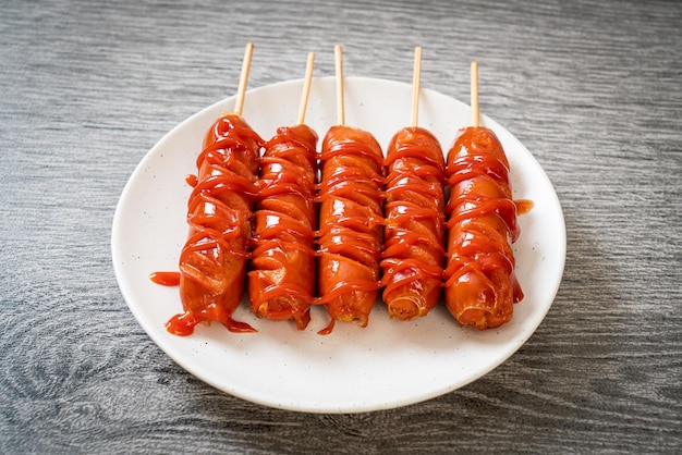 Fried sausage skewer with ketchup