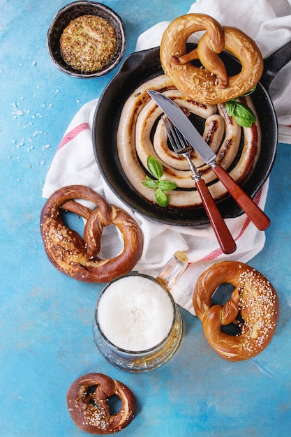 Fried sausage with beer and pretzels