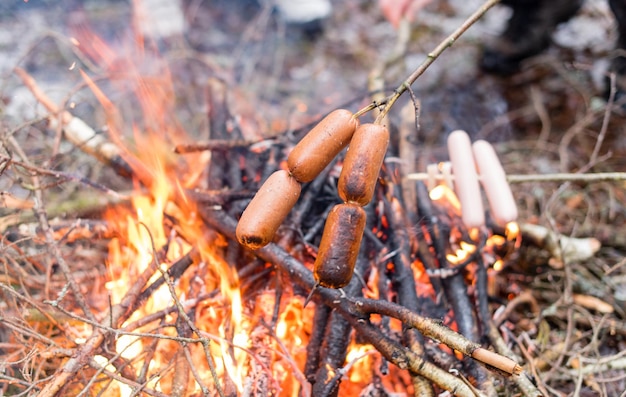 Fried sausages cooked at the stake