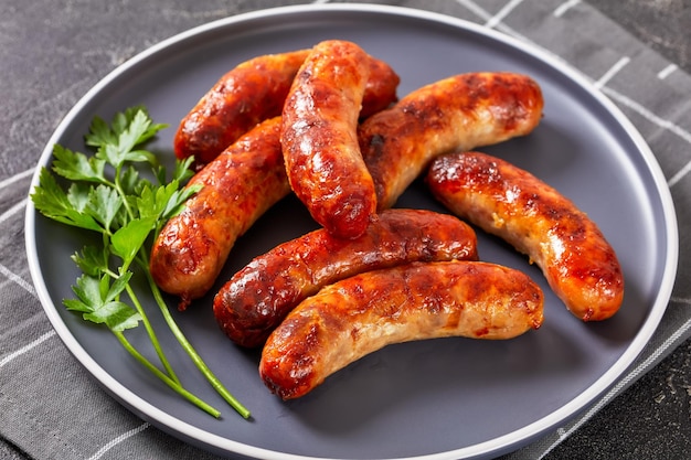 Fried sausages on a plate top view