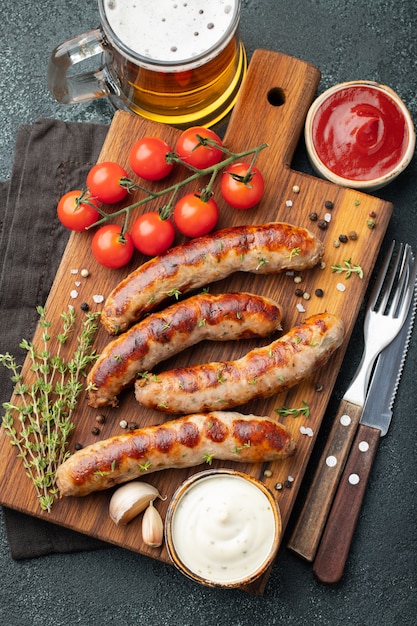 Fried sausages with sauces and herbs.