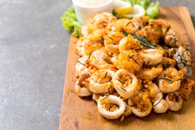 fried seafood (squids, shrimps, mussels) with sauce