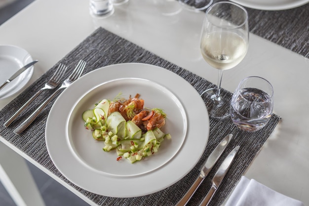 Fried shrimps salad on cucumber with sauce. Luxury gourmet food dish, closeup. Fresh food background