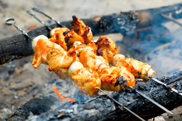 fried slices of meat on the grill