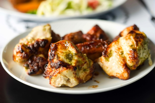 fried slices of meat on the grill