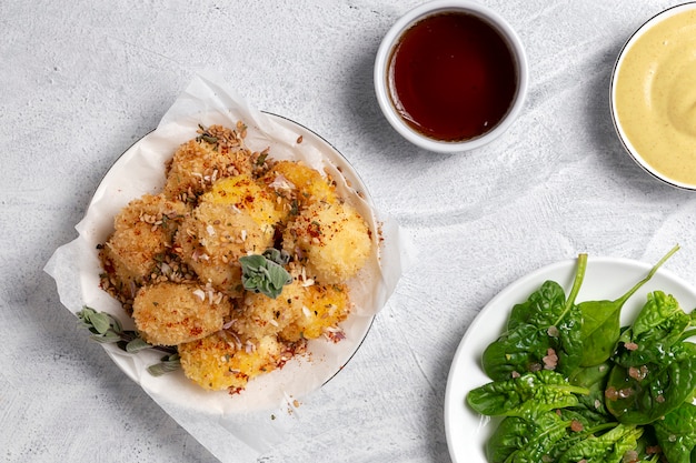 Fried small cheese mozzarella balls breaded in panko