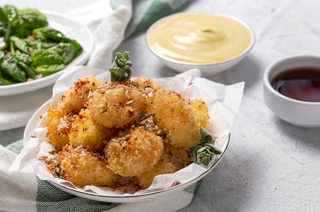 Fried small cheese mozzarella balls breaded in panko