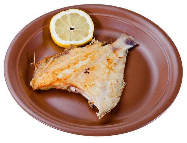 Fried sole fish on brown plate