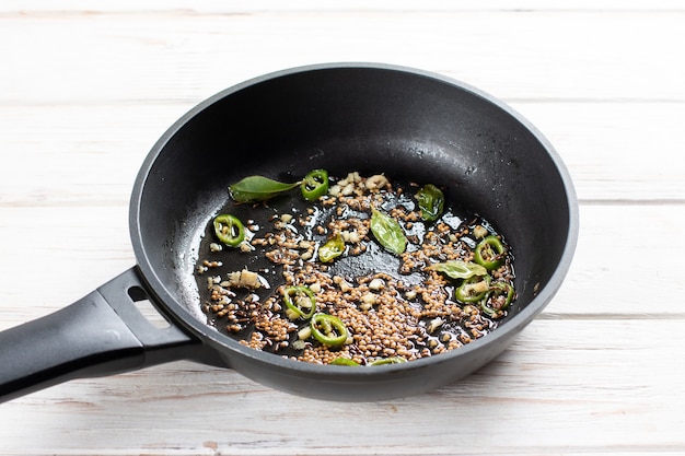 Fried spices in a pan