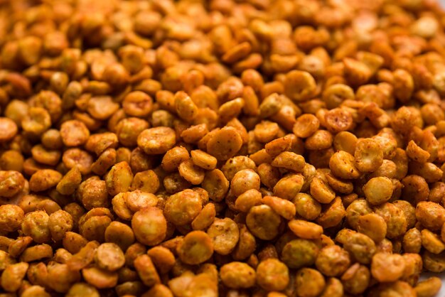 Fried and Spicy Chana Dal Masala is a popular Chakna recipe. served in a bowl. selective focus