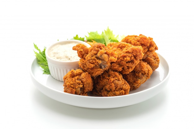 fried spicy chicken wings with vegetable