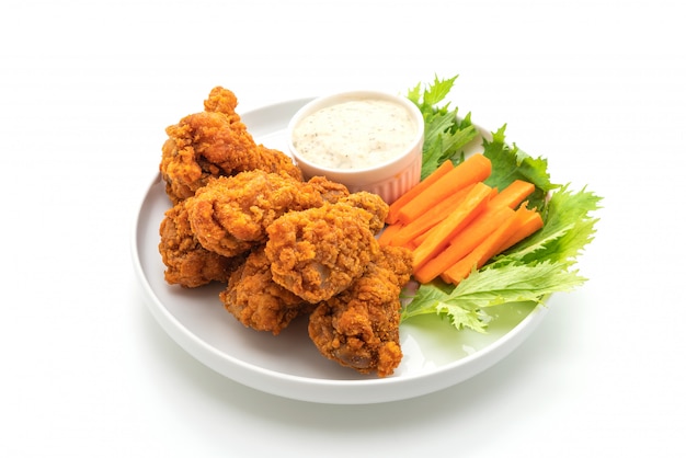 fried spicy chicken wings with vegetable