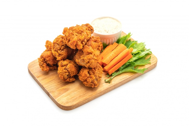 fried spicy chicken wings with vegetable