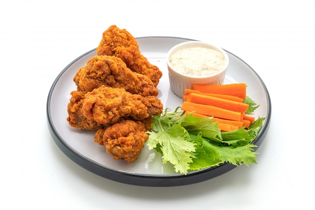 fried spicy chicken wings with vegetable