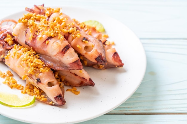 Premium Photo | Fried squid with garlic