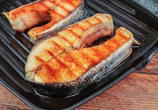 Fried steaks of red fish on the grill pan