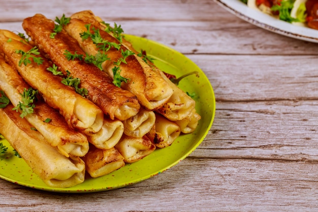 Fried taquitos stuffed with meat Mexican cuisine.