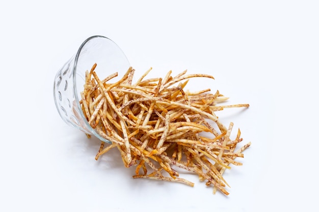 Fried taro sticks on white background.