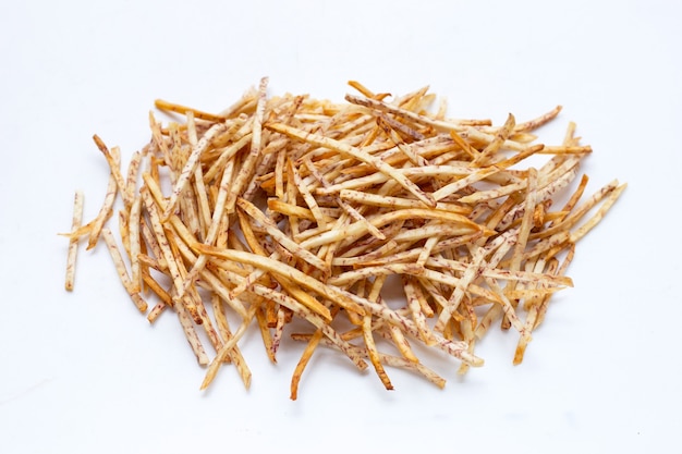 Fried taro sticks on white background.