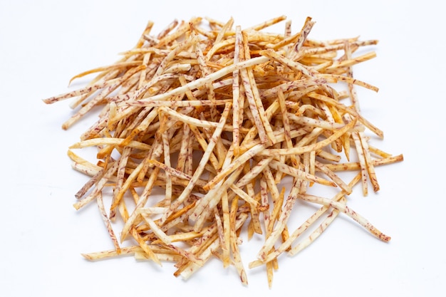 Fried taro sticks on white background.