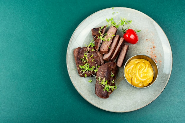 Fried tasty ostrich steaks