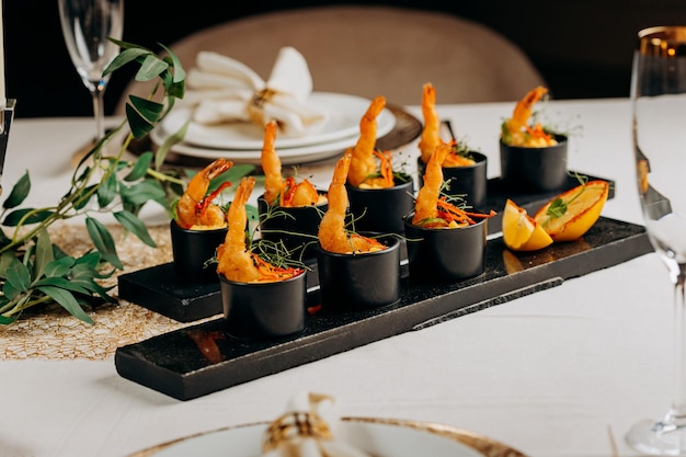 Fried tiger shrimps in breadcrumbs served with mango sauce ready for furshet in restaurant Seafood shellfish