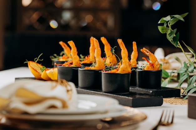 Fried tiger shrimps in breadcrumbs served with mango sauce ready for furshet in restaurant Seafood shellfish