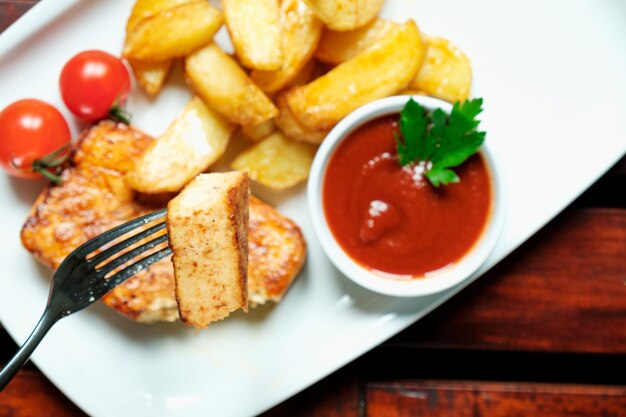 Fried tofu with spices potatoes with fresh tomatoes