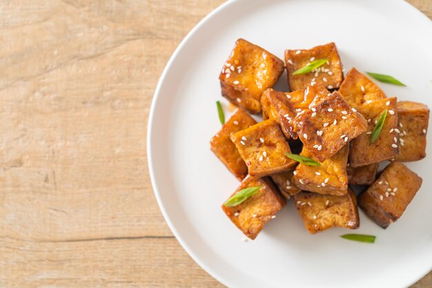 Fried tofu with white sesame and teriyaki sauce