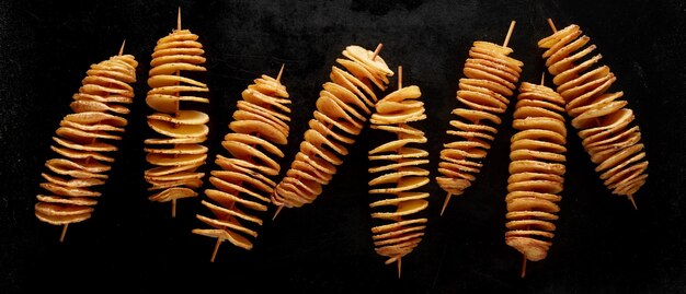 Fried twist potatoes on skewers