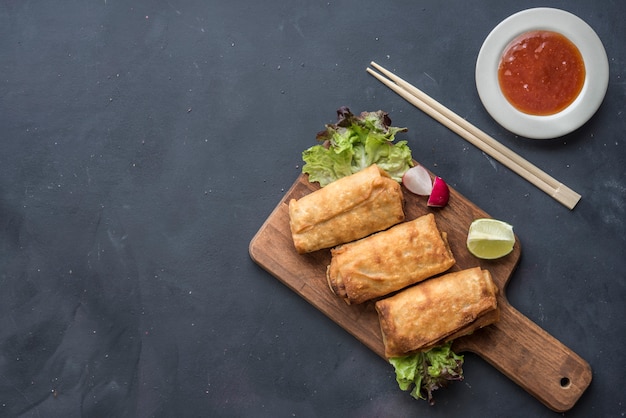 Fried vegetable spring rolls with fresh ingredients