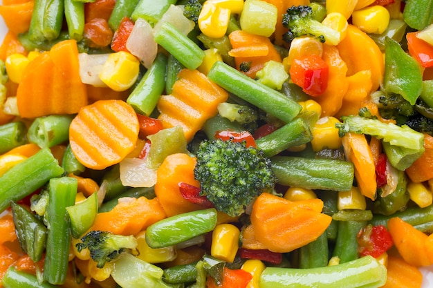 Photo fried vegetables  in a white plate.