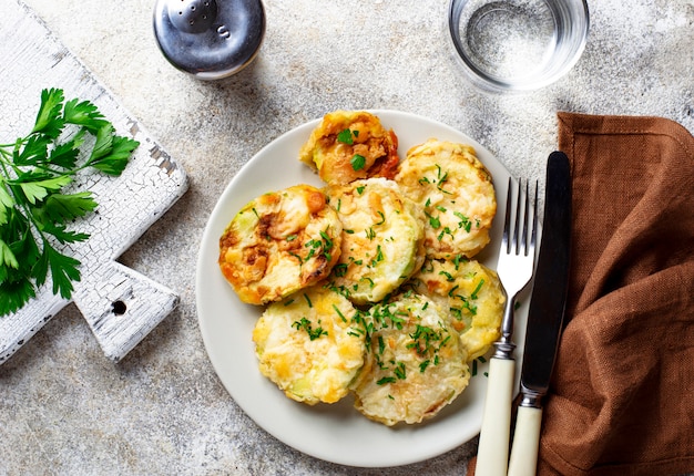 Fried zucchini slices with parsley