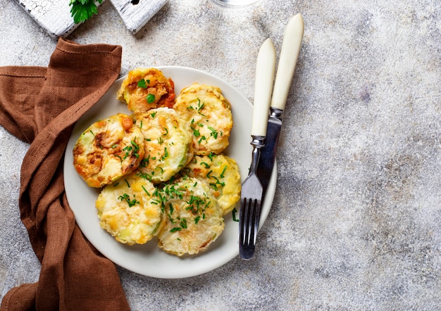 Fried zucchini slices with parsley